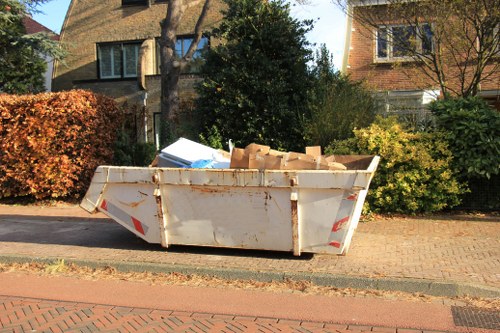 Office furniture being removed during clearance in Bethnalgreen